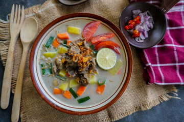 Soto Betawi is a traditional food from Jakarta, consisting of a mixture of coconut milk and milk sauce, meat, offal, carrots, potatoes, lime and spices.
