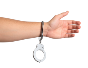 Hand in metal handcuffs with open palm gesture showing arrest detention restraint concept