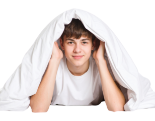Smiling teenager under white blanket with hands supporting head, cozy morning or bedtime portrait isolated on transparent background