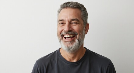 Fototapeta premium An old man laughing with genuine joy, captured against a clean white background