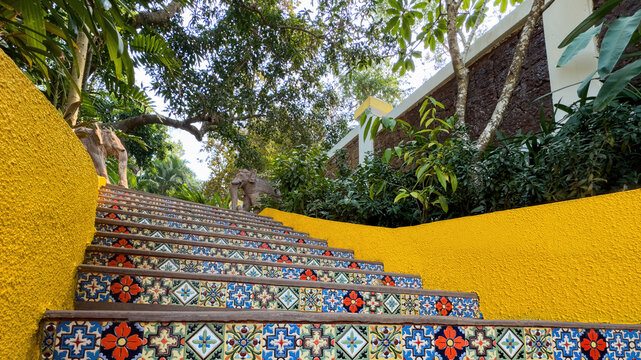 Enchanting Tropical Staircase with Colorful Tile Art and Elephant Sculptures