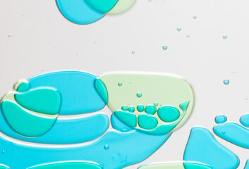 Abstract Close-Up of Colorful Liquid Bubbles on a Clear Surface