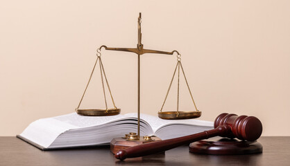 The scales of justice, the judge's gavel and an open book