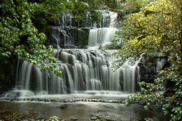 Serene Cascading Waterfall in Lush Greenery