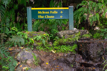 Signpost to Mclean Falls and The Chute in Lush Forest