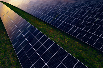 Solar panels park generating green energy electric at sunset.Green energy reduce carbon emissions...