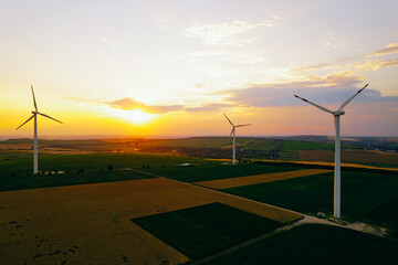 Wind Power turbines generating green energy electric.Green energy helps reduce carbon emissions and...