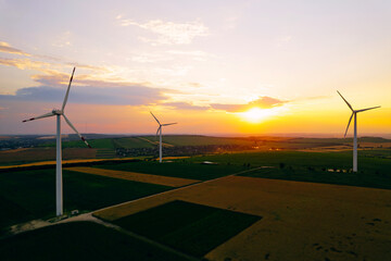 Wind Power turbines generating green energy electric.Green energy helps reduce carbon emissions and...