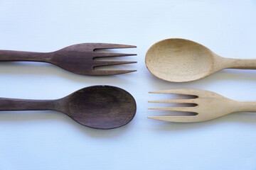 wooden spoon and fork isolated on white background