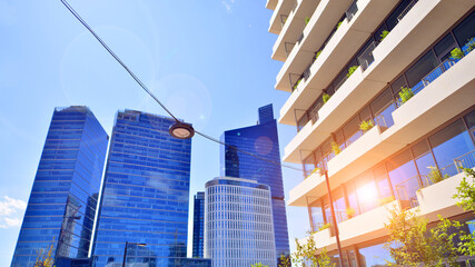 Modern office building with glass facade. Transparent glass wall of office building. Reflection of...
