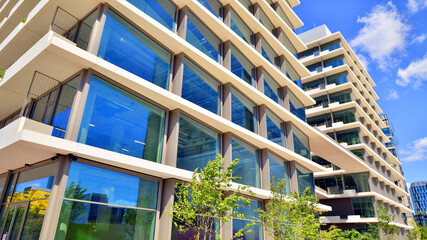 Office with green environment. Corporate building reduce CO2. Sustainable glass office building...