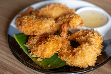 Fried shrimp served on plate with vegetable