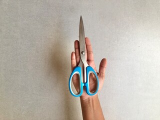 Scissors on the palm