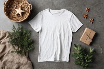 White T-shirt Mockup with Gift and Decoration on Gray Surface