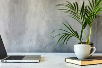 Ultra Hd Image of a Coffee Cup is Next to a Laptop and a Book with a Plant on it