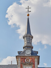Detail of a tower crowned by spires in Plaza Mayor, Madrid, Spain.