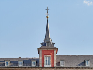 Detail of a tower crowned by spires in Plaza Mayor, Madrid, Spain.