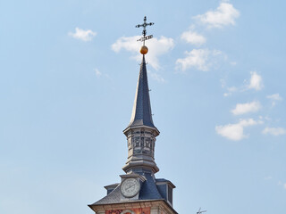 Detail of a tower crowned by spires in Plaza Mayor, Madrid, Spain.