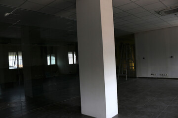 Photo of a dark empty room in an abandoned building