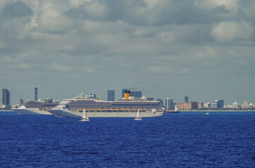 Modern cruiseships cruise ship liners Magica, Seaside, Armonia and Fortuna anchored offshore of...
