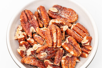 Pecan nut isolated. Pecan nuts are a rich source of energy and contain lots of nutritional benefits. Toasted pecans.