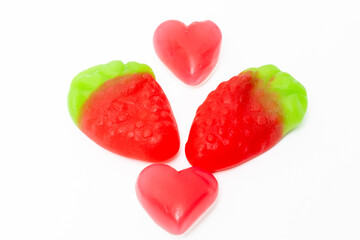 Naklejka na ściany i meble Fruit jelly beans in many colors in a glass bowl on a white background.