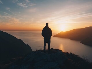 ultra quality picture of overlooking view of a silhouette of mountains in the sea during sunset