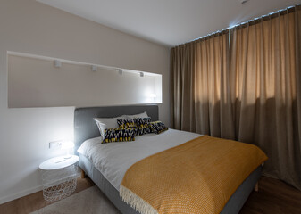 Modern Bedroom Interior Design with Warm Lighting and Stylish Furnishings