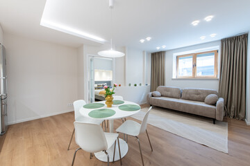 Modern Home Living Room with Sofa and Dining Table Decorated Sofa in Background