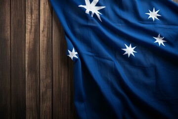 Australian flag draped over a dark wooden table, creating a patriotic scene