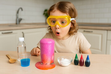 Child making a chemical volcano experiment at home kitchen