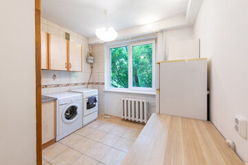 Bright Kitchen Interior Design Featuring Appliances and a View to Greenery Outdoors