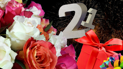 Birthday card  in numbers , roses, gift, fireworks light sky. Age is 21