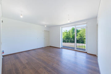 Minimalist Apartment Interior with Wooden Floors and Large Balcony Windows