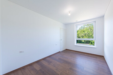 Bright Minimalist Empty Room With Wooden Floors and a Scenic Window View