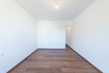 Spacious Empty Living Room With Hardwood Flooring and Minimalist Interior Design