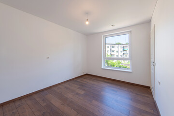 Bright Minimalist Empty Room with Wooden Flooring and Scenic Outdoor Views