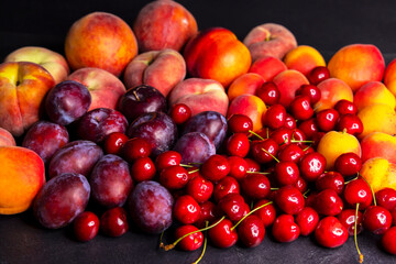 Fresh Summer Fruits Displayed on Dark Background