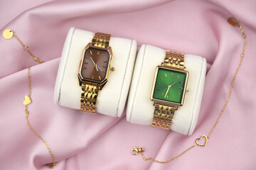 Closeup minimal fashion wristwatch for women on pink background.