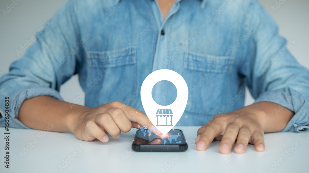 Poster a man using a smartphone with a virtual map location icon and store symbol, representing online stor