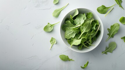 Obraz premium Artistic composition of arugula leaves arranged in a spiral pattern on a minimalistic background.