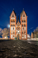 A cathedral in a city, beautifully illuminated at dusk. Morning in Limburg, Hesse