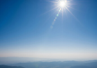 Bright sky with sun flares