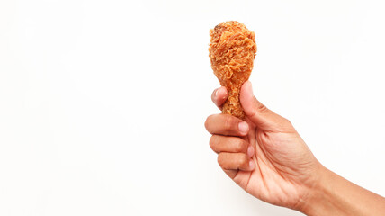 Hand hold fried chicken isolated on white background  © VerraWidhi