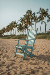 Blue and White Lounge Chairs on Sandy Beach Under Clear Sky