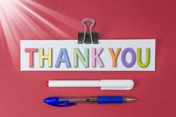 Thank you text on a red background