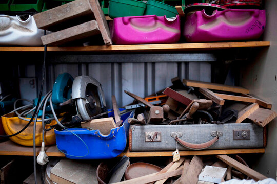 Tools in boxes on a shelf