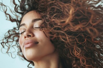 Clear Pixel Picture of a Woman with Curly Hair is Waving in the Wind