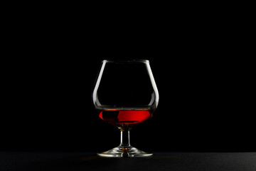 A Single Glass of Amber Liquid on a Dark Background: The Perfect Representation of Elegance and Sophistication in Beverage Presentation