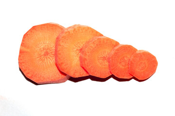 Chopped Sliced Orange Carrot Vegetable Pieces on White Background